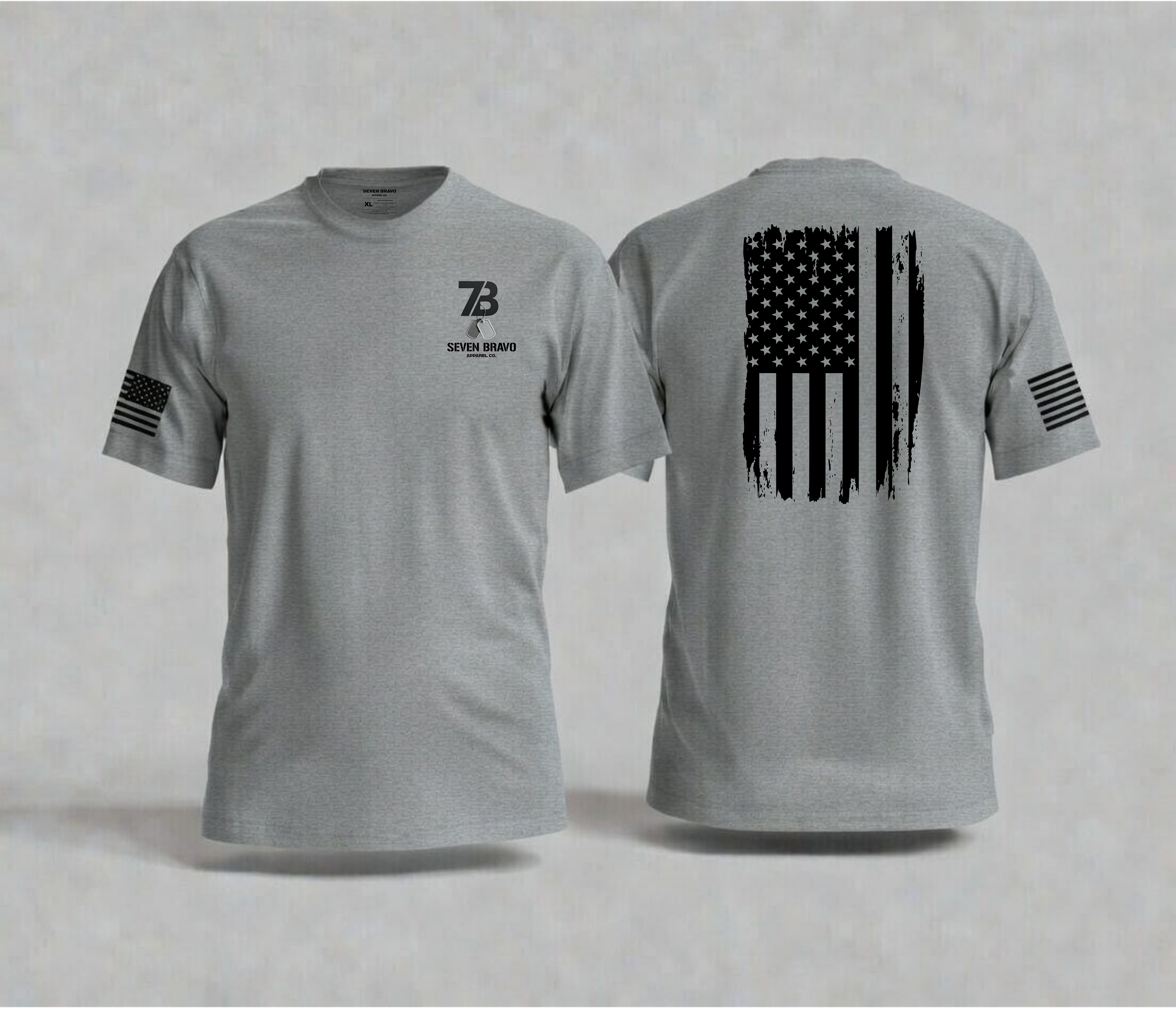 Grey t-shirt with American flag design on the back and seven bravo logo on the front